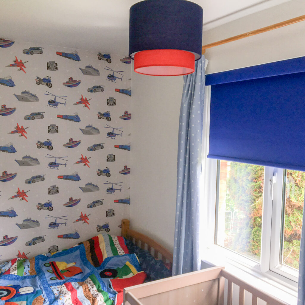 Blue blackout roller blind in a children bedroom window