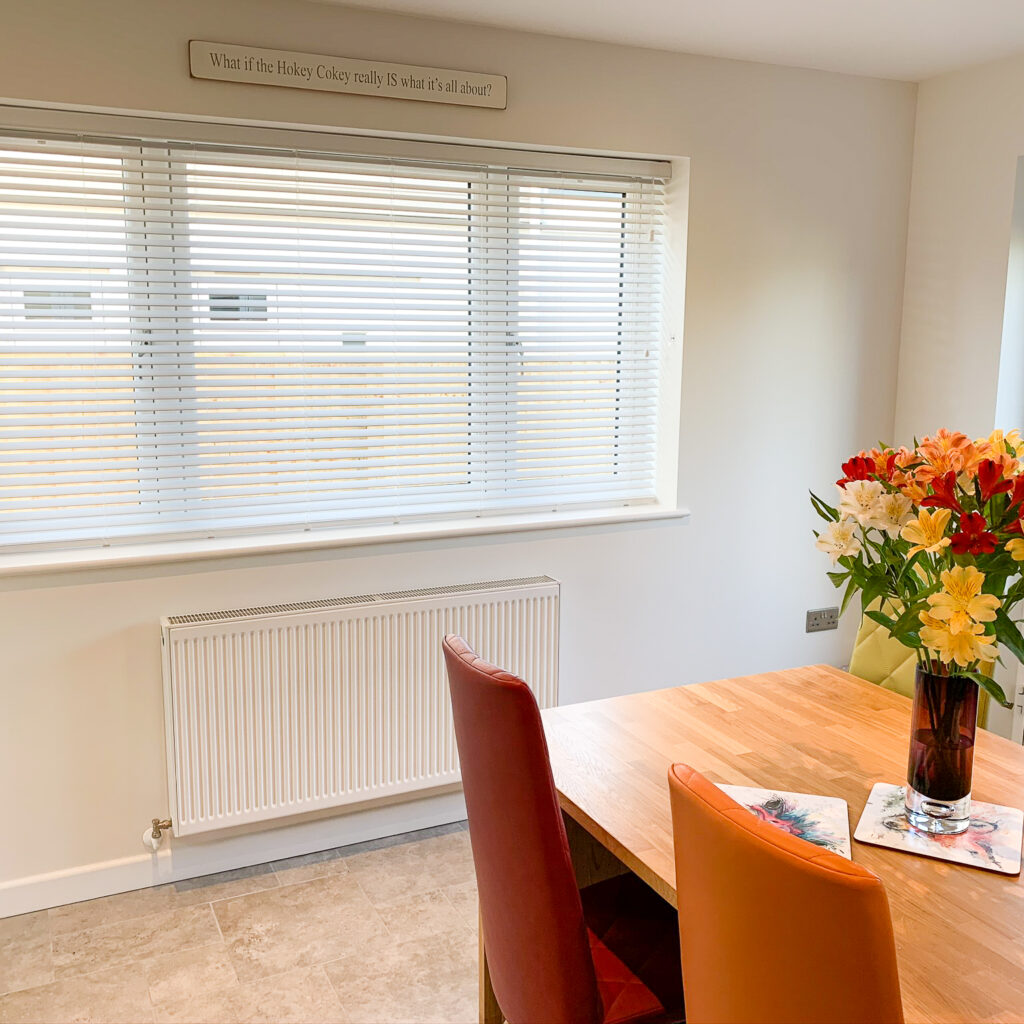 White wood Venetian blind to a dining room in Bramdean Hampshire