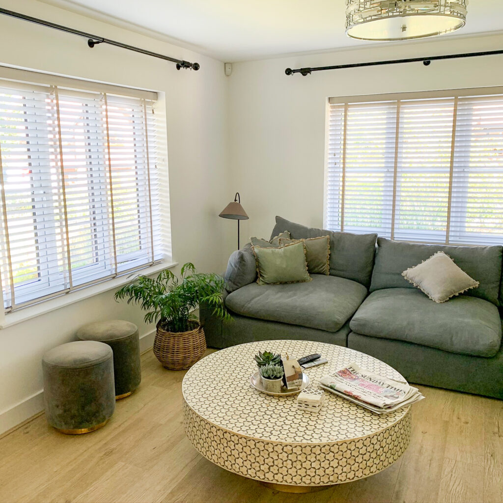 2 Wood Venetian blinds in living room windows