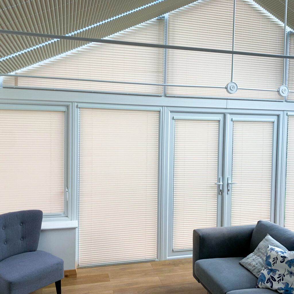 Cream pleated conservatory blinds on conservatory windows