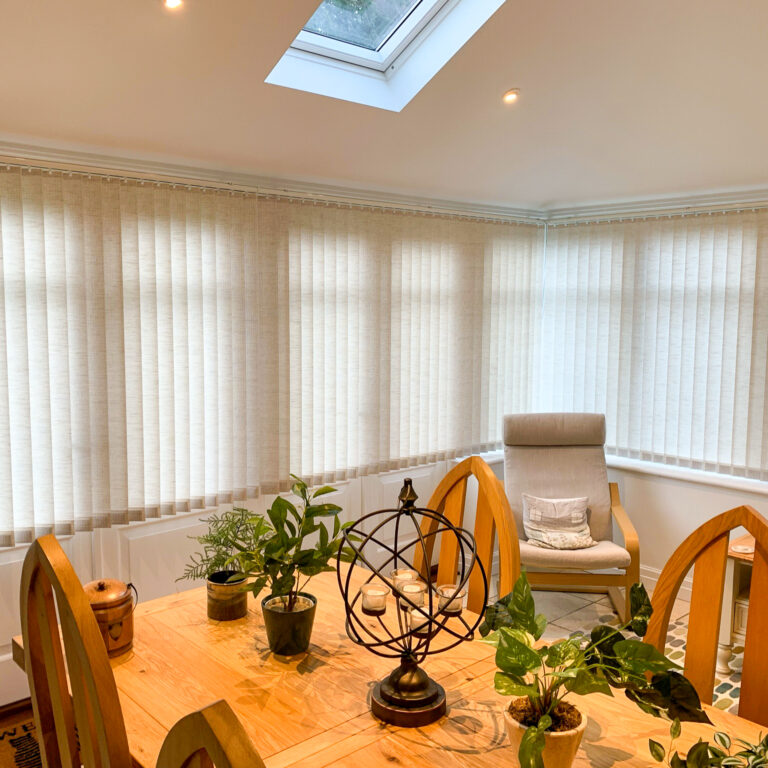 Vertical blinds in a dining room window