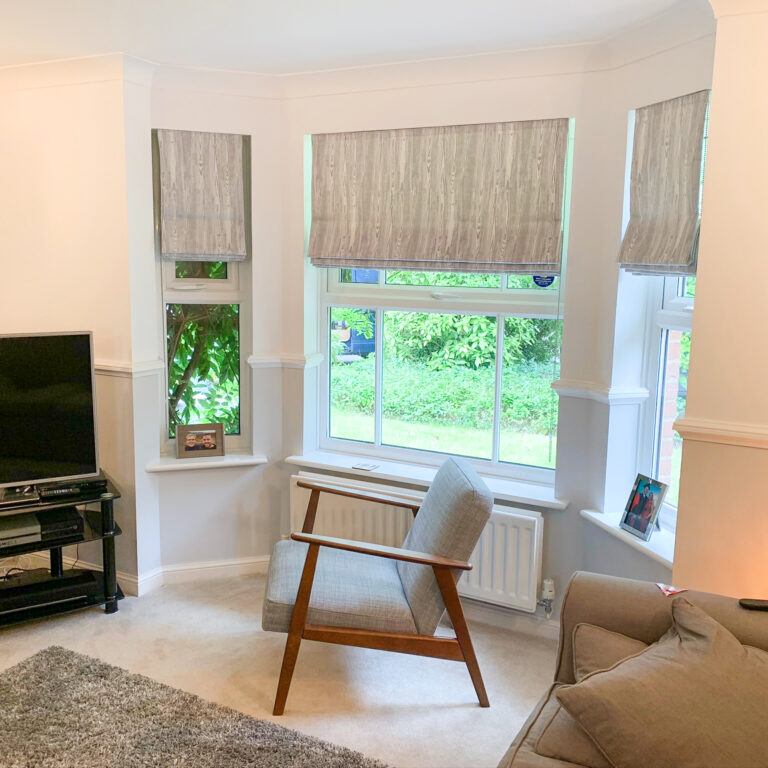 Grey print Roman blinds in a living room