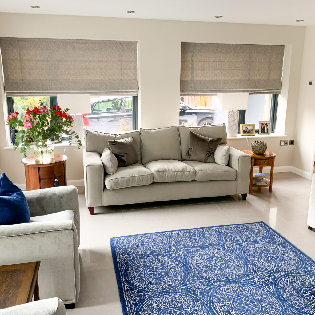 Grey Roman blinds in a living room